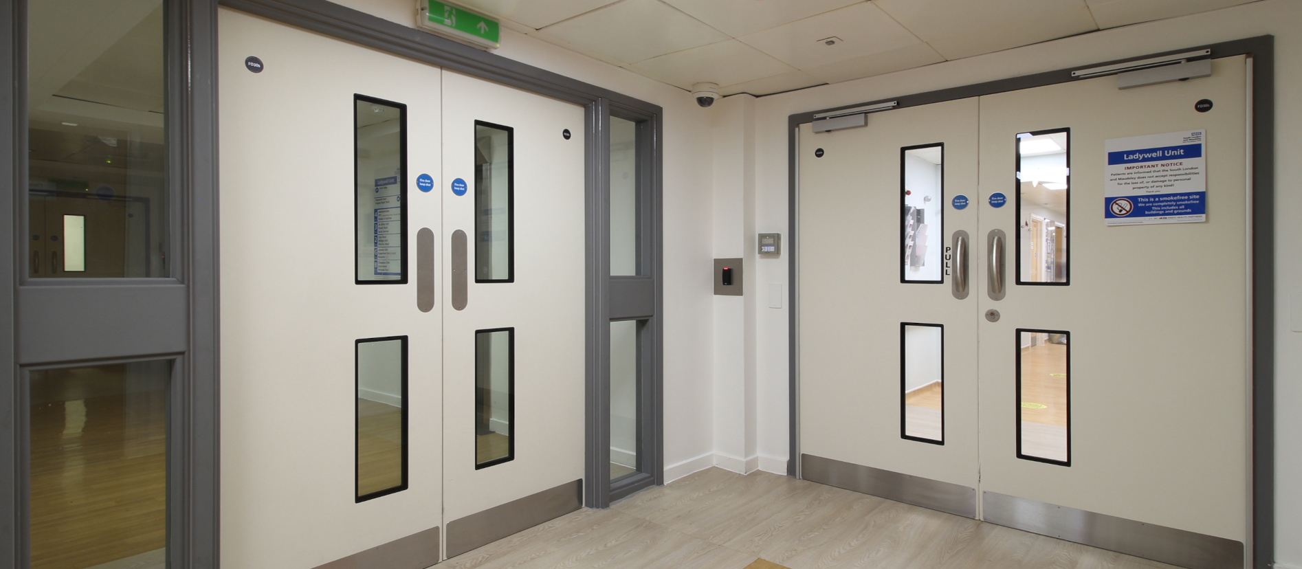 Metal doors with vision panels in a commercial interior — MKR website image collection